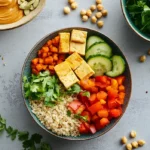 Plant-based protein foods including tofu, lentils, quinoa, chickpeas, seeds, and vegetables on a bright kitchen table