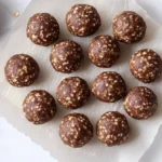 High protein snacks for kids no-bake protein balls plated in a bright modern American kitchen.