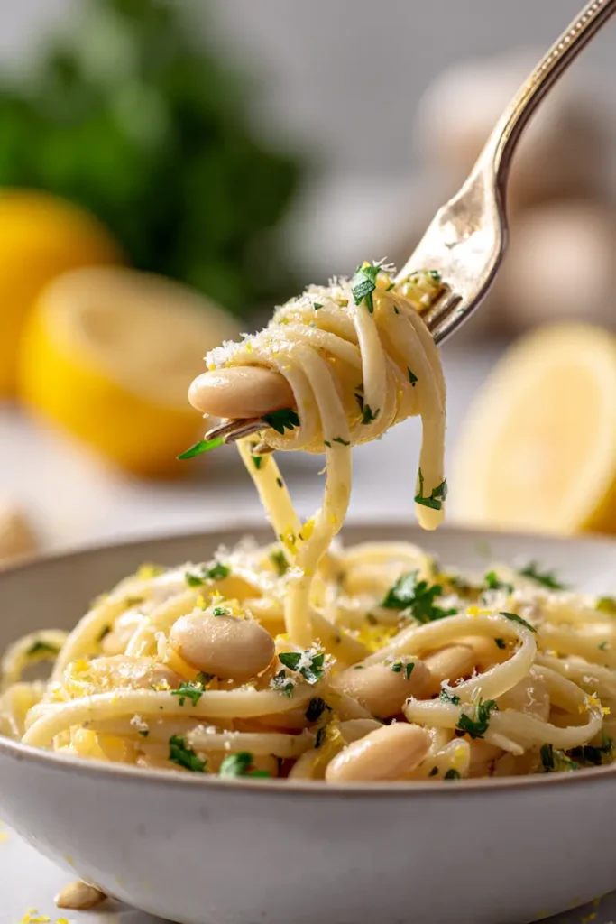 Lemon Garlic White Bean Pasta Recipe 2 Close-up of creamy lemon garlic white bean pasta with white beans, herbs, and Parmesan.