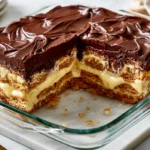 Egg-free chocolate eclair dessert with creamy vanilla layers and chocolate topping