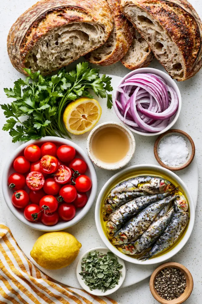 Sardine Toast with Roast Tomatoes & Pickled Onions 2 Fresh ingredients arranged neatly for making sardine toast.