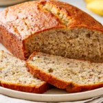 Simple homemade banana bread loaf with two moist slices